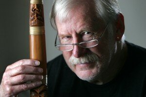 Dr Richard Nunns holding a putorino (a Maori instrument made from matai wood)